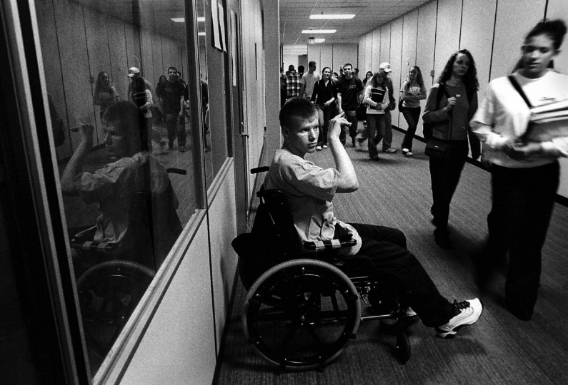 Between classes, Jason always asked to be wheeled to the hallway so he could wave to people he knew.