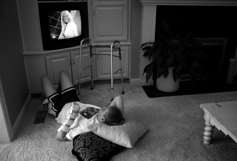 Four years after graduation, Jason still lives with lingering effects of the brain injury. He often spends long hours watching television